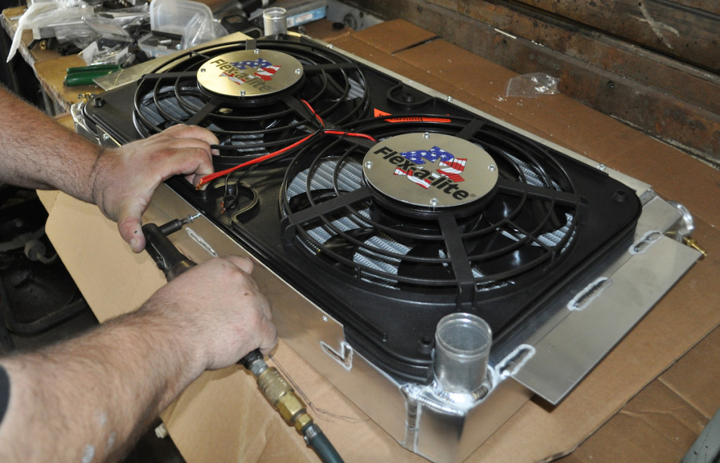 Converting to an electric fan is a good way to pick up some power and solve overheating issues at slow-speed or idle. Just like a mechanical fan, though, proper shrouding is very important. This Flex-a-lite dual fan has a rectangular shroud. The company offers many electric fans that cover a wide variety of radiator dimensions.