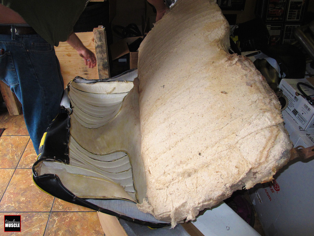 The back seat disassembles in a similar fashion to the front seats, cutting the old hog rings off then pulling the old seat covers away from the seat foam.